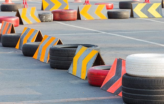 Image of metal Crash guards placed on car racetracks.