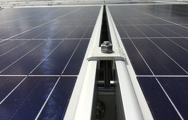 Close-up view of the top-of-pole mounted structures for solar panels.