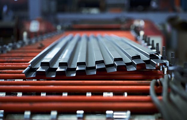 Metal sheet fabrication in a warehouse factory.