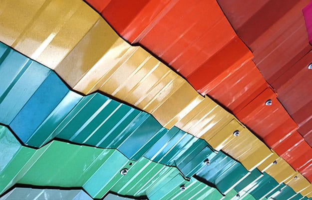 Close-up image of multi-colored metal roof sheets.