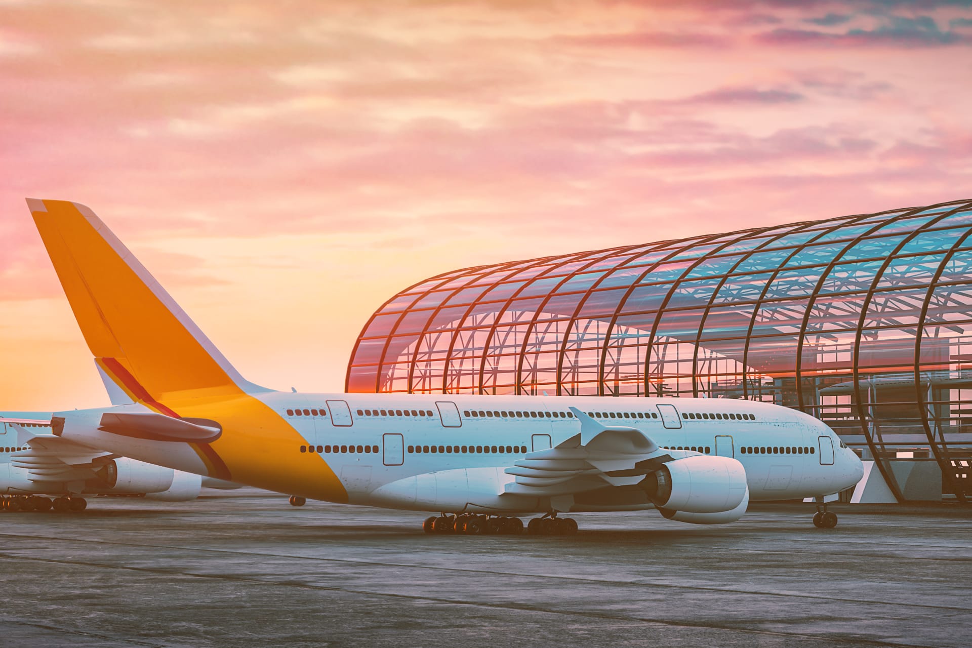 An airplane in front of a pre-fabricated metal roof at an airport.