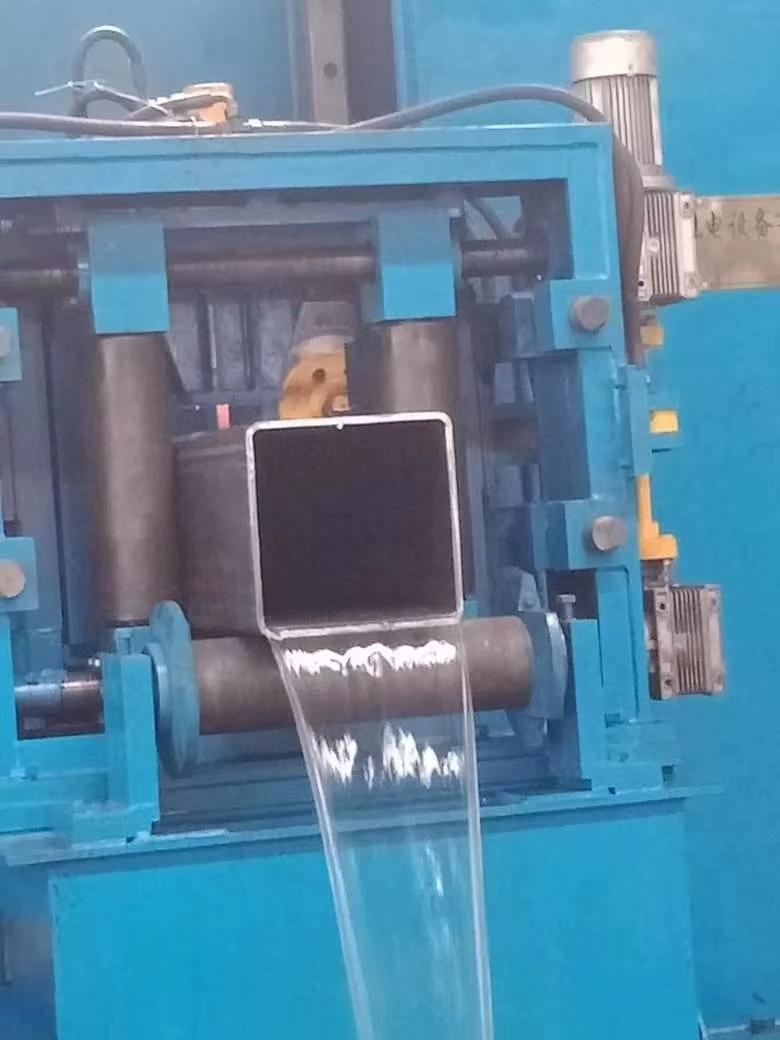 Image of a square pipes under manufacturing process.