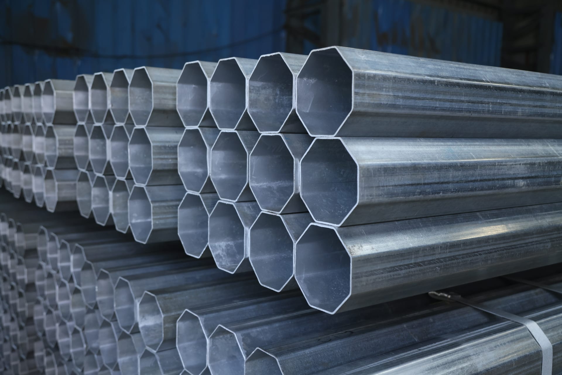 Image of hollow sections stacked in a warehouse.