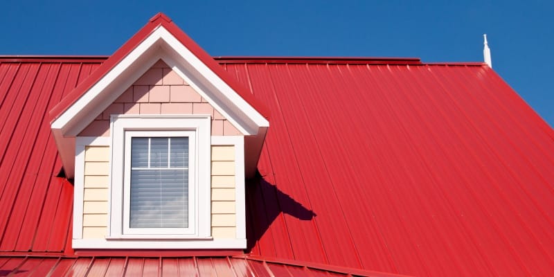A modern home roof constructed with red color coated roofing sheet.